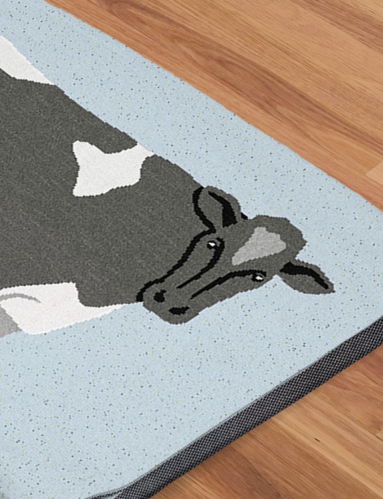 A DrakeKnit Cow blanket close up